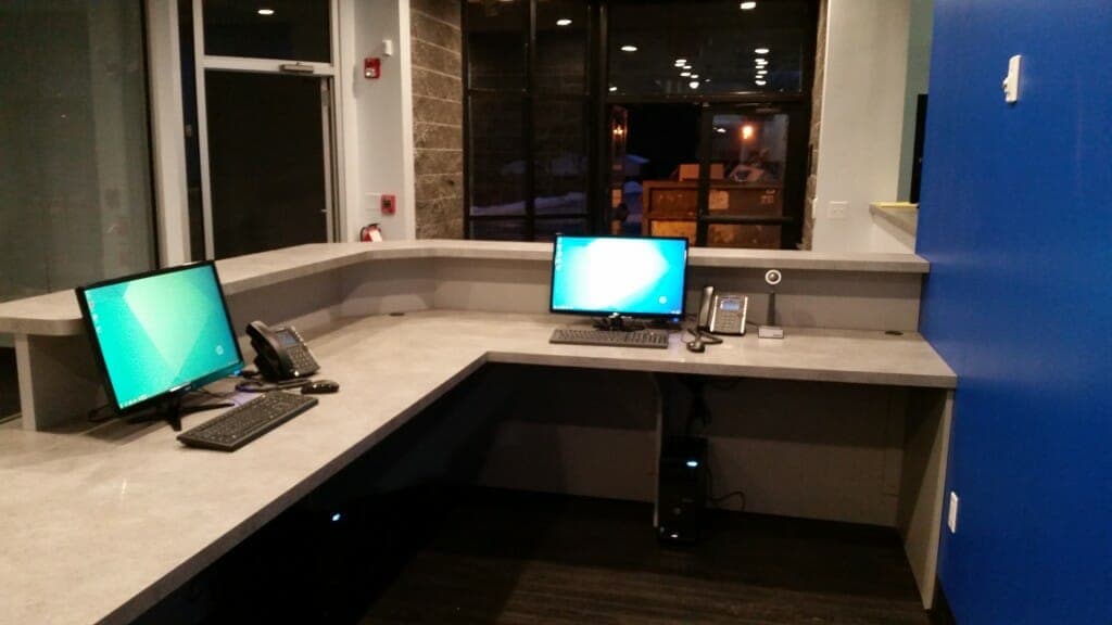 Two computers set up at the reception desk